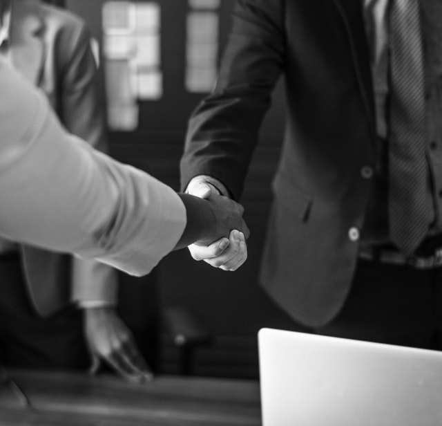 two people shaking hands