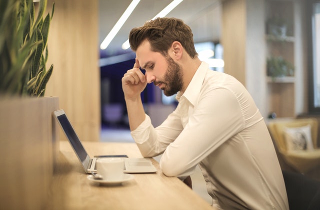 Man using the laptop thinking