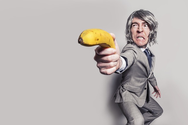 A sales rep pointing a banana representing why everyone hates sales reps.