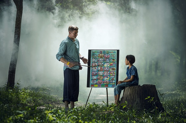 A teacher teaching a student representing the sales lessons I learned in my sales career