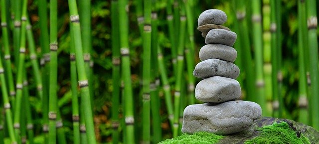 pile of stones and bamboo background